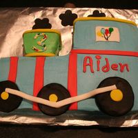 Birthday Train My first carved cake. I got ideas from lots of cakes on CC. Thanks "train cake makers." Iced in buttercream with fondant accents...