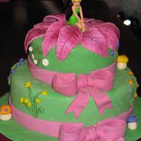 Tinkerbell Made for little girl's 4th birthday. All decorations are fondant/gumpaste except for Tinkerbell. I knew I wouldn't be able to...