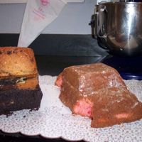 Lightning Mcqueen & Mater - Front Before Icing Lightning McQueen: Wilton 3D car pan, used circle cookie cutters to cut out where the wheels would go.Mater: Large Loaf pan, extra cake...