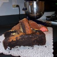 Lightning Mcqueen & Mater - Uniced Side View Lightning McQueen: Wilton 3D car pan, used circle cookie cutters to cut out where the wheels would go.Mater: Large Loaf pan, extra cake...