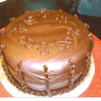 Chocolate Ganache Chocolate cake with chocolate mousse filling. covered in chocolate ganache. This was my first time making this and it was delicious but I...