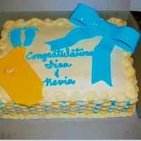 It's A Boy 1/4 sheet marble cake, butter cream icing. Feet, bow, and onsie are made of fondant.