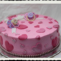 Hearts Chocolate cake with buttercream and fondant heartsthe soothers are from the dollar store with self adhesive righinstones