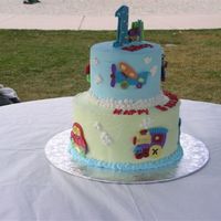 First Birthday Cake This cake was done with candy melts to match the birthday party plates and theme. So much fun to do and everyone raved about it.