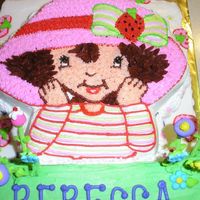 Strawberry Shortcake This was for a co-workers 4 yo birthday. The botttom cake is strawberry flavored. The green is pound cake and the character pan is...