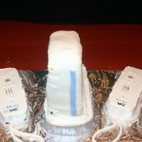 Wii Console And Remote THANKS TO SUE FOR YOUR HELP IN "CONSTRUCTION" OF THE CONSOLE!Used fondant for remote buttons, the silver band on the bottom (...