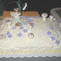 Fairy Cake A cake I made for my oldest granddaughter. Was a sheet cake (cherry chip) with a banana pudding/whipped cream filling. The cake is accented...