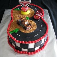 Cars Cake This cake idea came from one of the cake decoraters on cake central, and it turned out great. My nehpew turned three, and he loves the car...