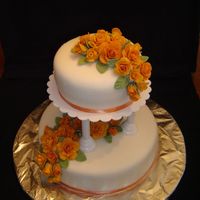 Picture_1_127.jpg This was my first time making fondant roses. The cakes are a 6" and 10", and they 6" was carrot with cream cheese filling....