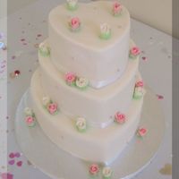 Heart Shaped Wedding Cake From Spectacular cakes AGAIN!! I really liked how it turned out though. Covered in fondant with homemade roses