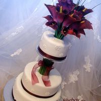 Le Mariage D'hiver SnowWhite Fondant and Royal SnowflakesThe bride's bouquet was matching Burgundy CallasNiagara "IceWine" Buttercream filled...