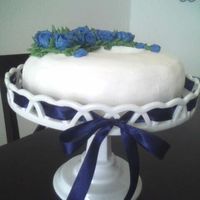 Blue_Roses_Cake2.jpg Just another cake... picture isn't that great - it's from my camera phone! :)