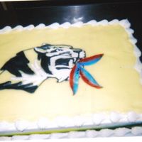 Mrsmith.jpg MU tiger eating a jayhawk. Chocolate cake with bavarian cream, tiger piped with bc and feathers made out of fondant