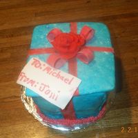 Gift Box Cake I made this cake for a friend of mine. It is a strawberry cake w/strawberry cream filling. First time ever doing a cake like this...I think...