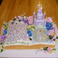Story Book Castle Butercream Book. Hand drawn Map on rice paper. RCT Fondant castle. Gumpaste Flowers.