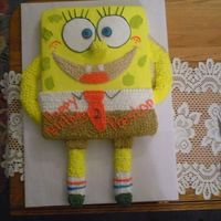 Spongebob I made this cake for a co-worker. The arms, legs, feet, and nose are made out of swiss rolls and entire cake is iced with bc.