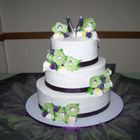 My Son's Wedding Cake White, oval using Sharon Z's buttercream recipe. Orchids, calla lilies, roses and rosebuds - painted with luster dust or dusted with...