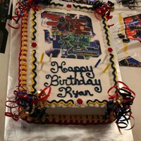 Transformer Cake Both of my boys had Transformer parties. Yellow cake with edible image.