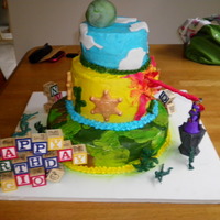 Toy Story Emporer Zurg Attacks This was my first attempt at toy story...it is all buttercream...exept a few fondant accesories and some chocolate badges...wish i had done...