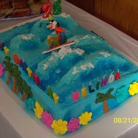 25Th Birthday Disney Luau Style This is a French Vanilla cake with Buttercream frosting...royal icing flowers to resemble leis...and rice krispy treat waves to support the...
