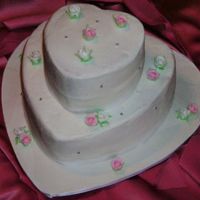 Bridal Shower Cake Heart/pink Theme Flowers are fondant on a buttercream covered cake. the cake is from 'spectacular cakes' by Mich Turner. Love the book great cake...