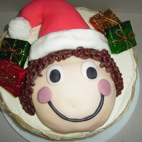 Emily's Christmas/birthday Cake I made this cake for my friend whose birthday is around christmas. It an8in layer cake and half of the mini round pan, face and hat made...
