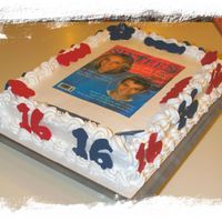 16Th B-Day White B-Day cake with Whipped Icing and chocolate decorations.