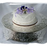 Mother's Day Cake This is a White Cake with MMF and Royal Icing Decorations. First time doing Cornelli Lace. I kinda Like it.