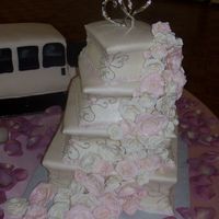 My First Wedding Cake This is my first wedding cake! all white and yellow cake with buttercream covered in MMF. I carved the sides of the cake in to give it a...
