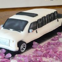 F350 Streched Limo Cherry Chip cake with chocolate mousse filling covered in MMF. The couple wanted the limo they would be in on the wedding day for their...