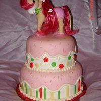 Strawberry Shortcake Strawberry Cake covered with MMF, and MMF accents. Strawberry Shortcake's horse on top.