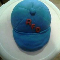 Baseball Hat Baseball hat cake made for the RFD softball team. This is my first cake so please tell me what you think