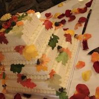 Fall Leaves Fall wedding cake decorated in white buttercream. The leaves were made of fondant and then "painted" with paste colors.