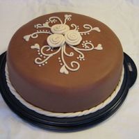 Swirls And "fabric-Roses" I made this for my own birthday yesterday. It's a chocolate cake with chocolate ganache. Covered with chocolate fondant, and...
