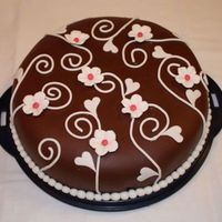 Swirls And White Flowers This is a chocolate cake I've made for my daughters Confirmation party today.