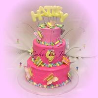 Butterfly Land I made this for my friend's daughter's bday. Chocolate cake with 'cream cheese' filling. Icing is buttercream,...