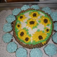 Sunflower Cake vanilla cake with ganach filling in the middle!! i made this for my mom and uncle's suprise 50th birthday. she is a twin. he really...