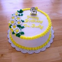 Birthday Cake For Dentist. I made this cake for a dentist. Iced with buttercream. Fondant daisies and color flow tooth.
