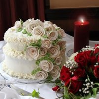 1St Wedding Top layer carrot cake, Bottom layer marble.. Buttercream frosting all around it.. Gumpaste roses
