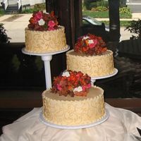 Fall Wedding Cake With Scrolls This cake is all buttercream with silk flowers. Thanks for looking!