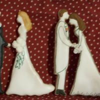 Bride And Groom Cookies One bride got bent as she baked but I like how it looks like he is kissing her head