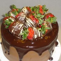 Ganache Panache Chocolate chip cake with cookies n' cream filling. BC icing with Ganache accent and chocolate covered strawberries