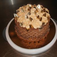 Anniversary Cake I did this friends wedding cake with ivory basketweave and thegold leaves....I used the leftover leaves to make this one for her a year...