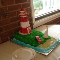 Lighthouse Cake Pic 2 Another angle on the lighthouse cake for my Mom!Lighthouse-on-land-with-beach cake for my mother's 50th birthday. Included functioning...