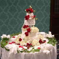 Scrolls And Flowers This cake was a simple ones with white scroll work on the sides. The flowers are all fresh.