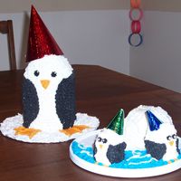 Penguin Birthday Cake The igloo is made out of ice cream and the little penguin are cake!