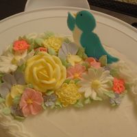 Course 2 Close up of royal icing flowers and color flow bird.