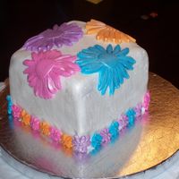Spring Flower Cake 2 Lemon Cake with buttercream filling, covered in fondant. Large and small daisys are fondant. The small daisys have silver dragees in the...