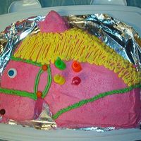 Horse My daughter wanted a pink horse for her birthday. She didn't like any of the horse cake pans, so I cut this one out of 11x13 pan.