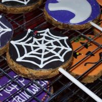 Chocolate Chip On A Stick Chocolate Chip pan cookies cut out with cutters, cooled and then placed on a stick for bouquets. MMF pieces attached with Antonias.